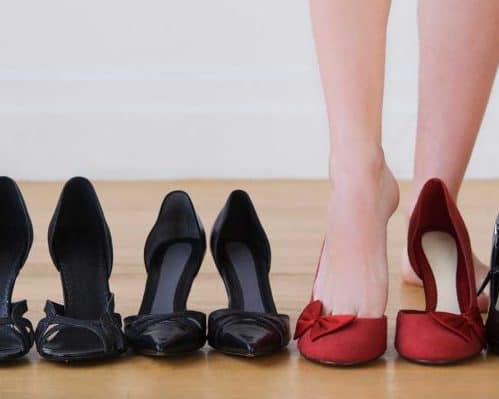Female feet and heels, woman's lags get tied of shoes with high