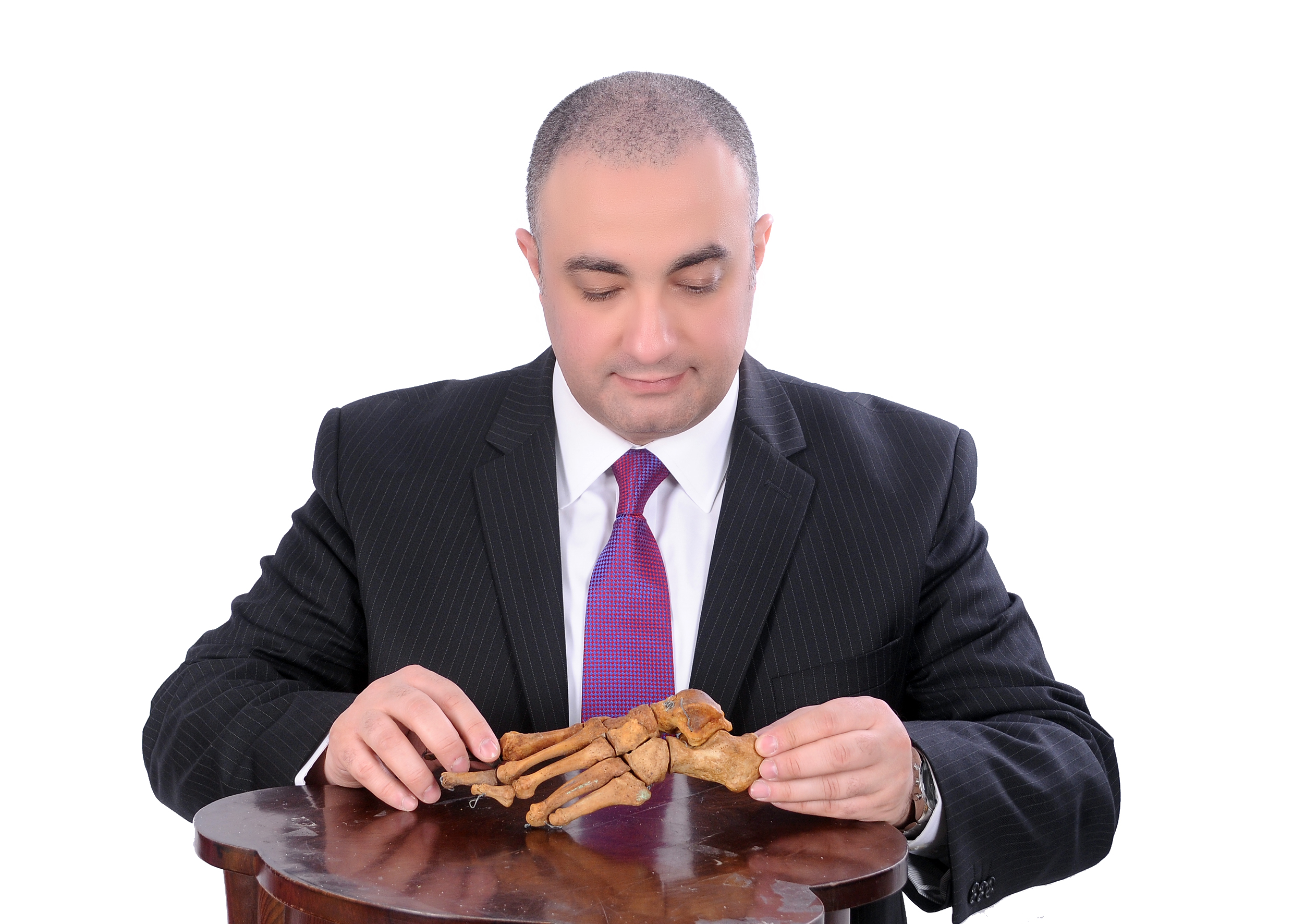 Mr Shalaby holding a foot